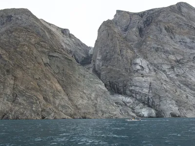 A mountain in the Dickson Fjord after 33 million cubic yards of its rock and ice collapsed in a landslide.