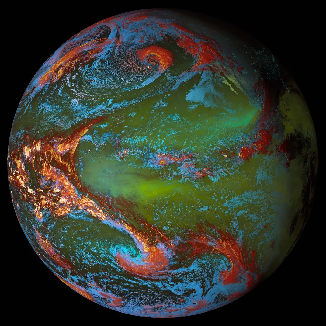 A depiction of Earth’s atmosphere features shown with green, red, and blue visualizations from a full view of the spherical planet from space