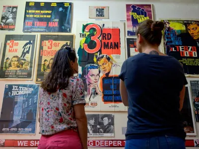 Visitors look at posters in the Third Man Museum in Vienna.