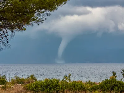 A waterspout photographed in the Adriatic Sea near Brac Island, Croatia, like the one implicated in sinking a yacht in Sicily this week. These sudden, violent storms are hard to predict and can occur more often in warmer waters heated by climate change.