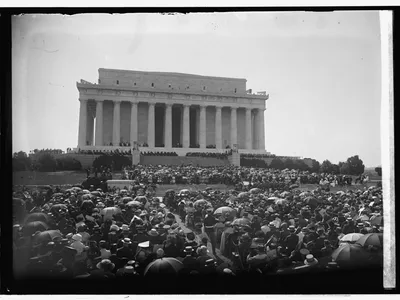 According to author Christopher A. Thomas, the dedication &quot;was a microcosm of the strained race relations of its day, marked by the rhetoric of good intentions and the behavior of bigotry.&quot;