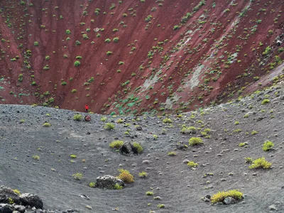 Thirteen-year-old Pedro de Frutos stands inside a dormant volcano near Timanfaya National Park. A series of eruptions
began in 1730 and lasted six years.