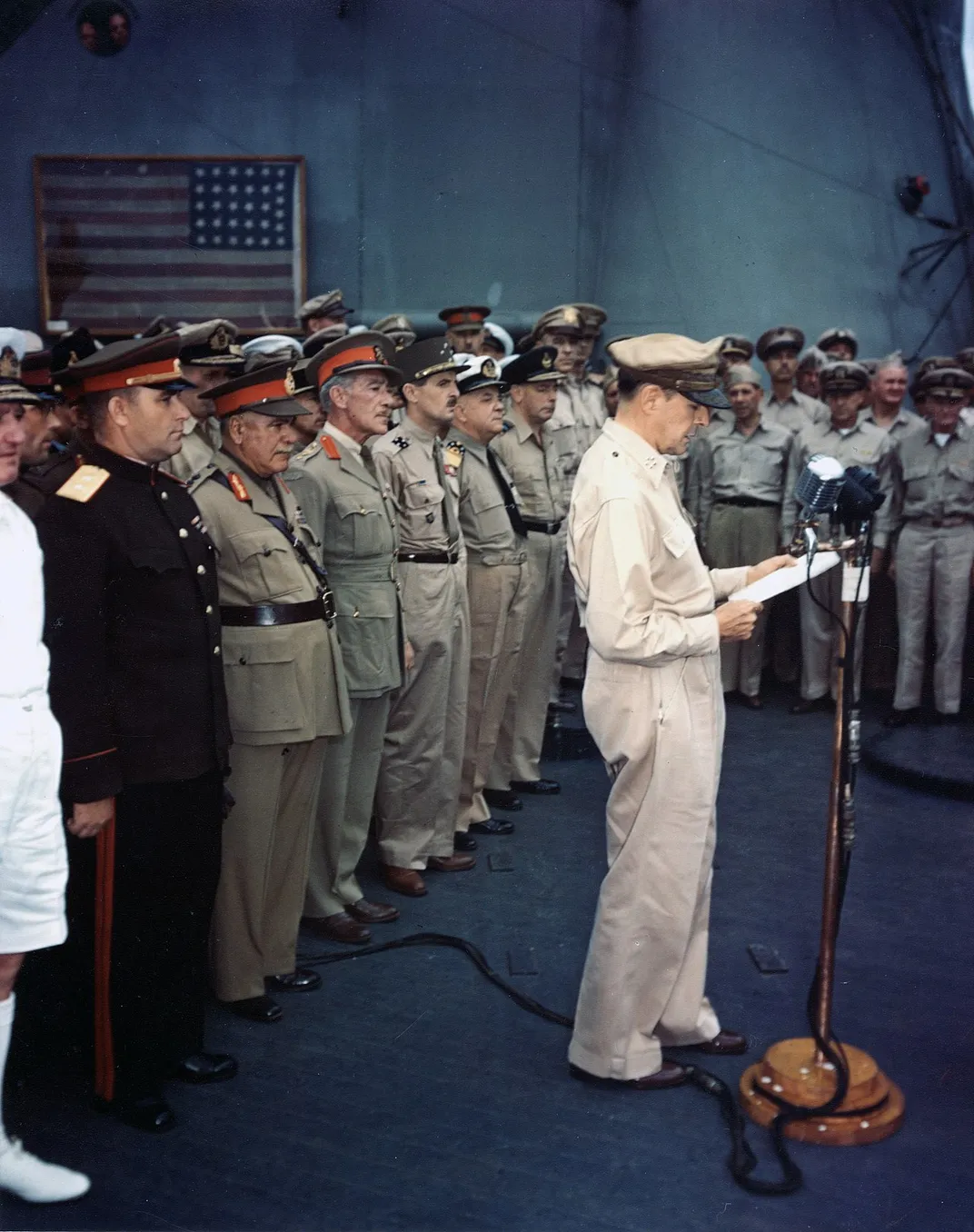 A photo of MacArthur, with the Perry flag visible in the background